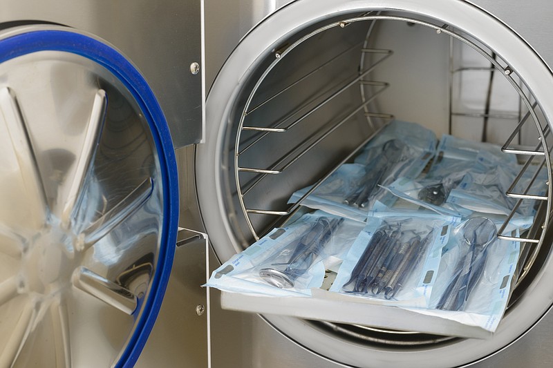 Sterilizing medical instruments in autoclave medical tile hospital doctor health instrument / Getty Images
