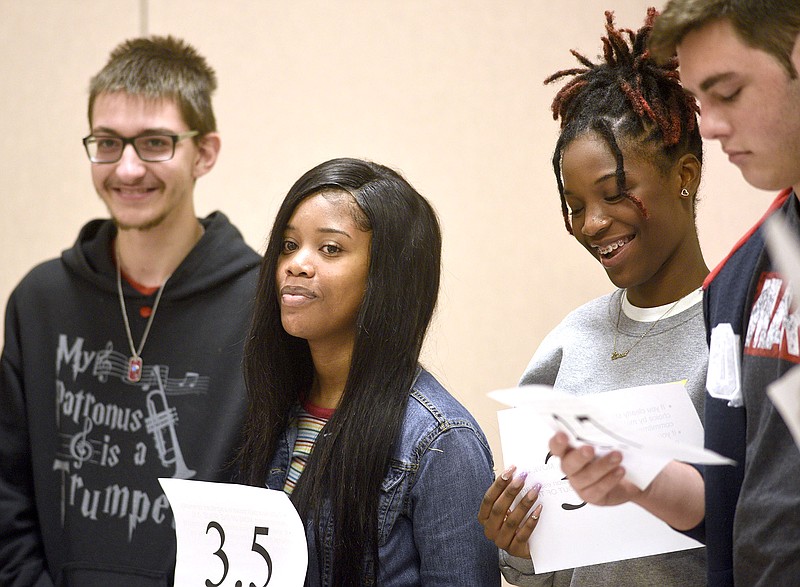 Staff Photo by Robin Rudd/ From left Zachary Offutt, Azariah Morrow, Abria Robinson and Kevin Resch share a laugh during a mock college admissions exercise that illustrates that there is more to getting into college than just your GPA. Tennessee Education Commissioner Penny Schwinn was keynote speaker at a free half-day conference for high school students, parents and educators on college admissions and preparing for college. The event was held at the University of Tennessee at Chattanooga's University Center on Oct. 19, 2019.