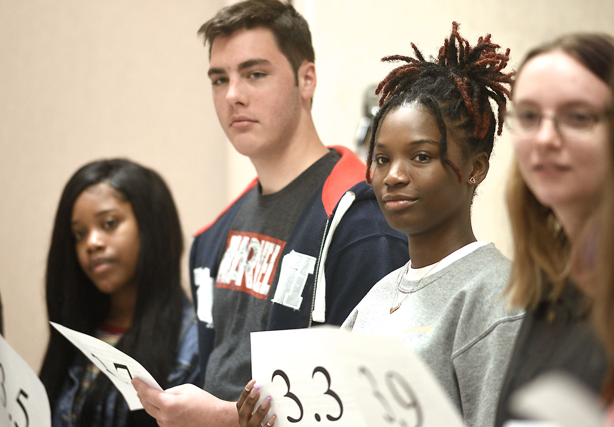 Staff Photo by Robin Rudd/ From left, Azariah Morrow, Kevin Resch, Abria Robinson and Madison Resch participate in a exercise to illustrate that is more to getting into college than your GPA. Tennessee Education Commissioner Penny Schwinn was keynote speaker at a free half-day conference for high school students, parents and educators to prepare students for college. The event was held at the University of Tennessee at Chattanooga University Center on October 19, 2019.