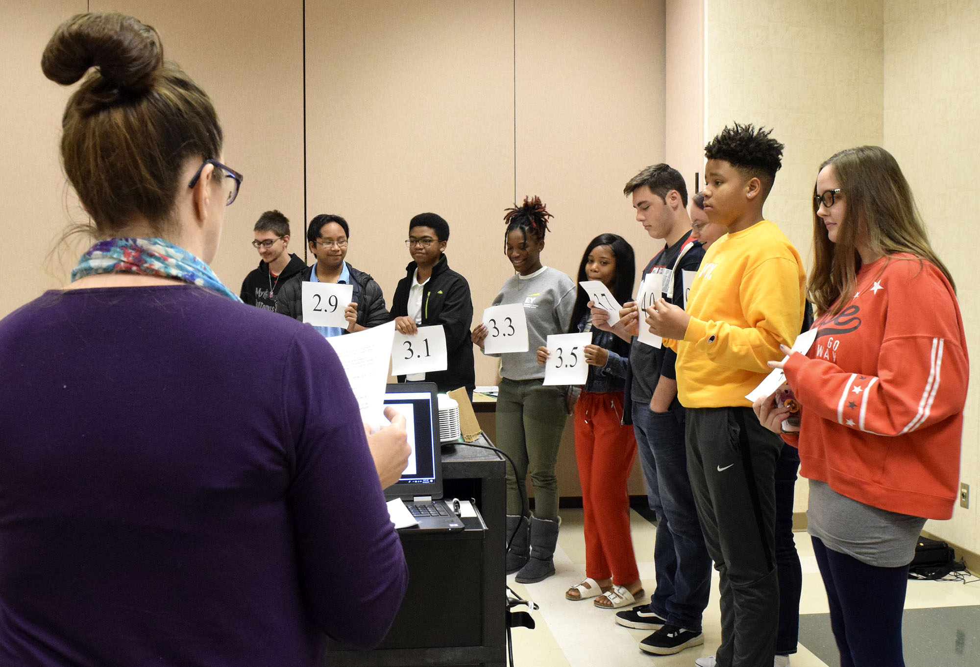 Staff Photo by Robin Rudd/ Sarah Malone, lead college and career advisor for Hamilton County Schools conducts a exercise, with students, to illustrate that is more to getting into college than your GPA. Tennessee Education Commissioner Penny Schwinn was keynote speaker at a free half-day conference for high school students, parents and educators to prepare students for college. The event was held at the University of Tennessee at Chattanooga University Center on October 19, 2019.