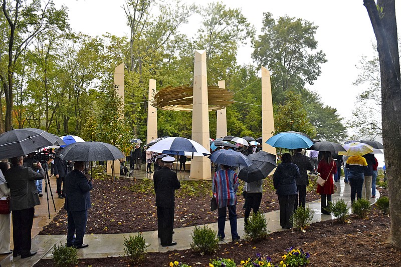 Staff Photo by Robin Rudd/  People circle the memorial, overlooking the Tennessee River, as they wait to make their respects.  The Wreath of Honor Memorial, honoring the five servicemen who lost their lives during the tragic shootings on July 16, 2015, was dedicated at the Tennessee Riverpark on October 19, 2019.
