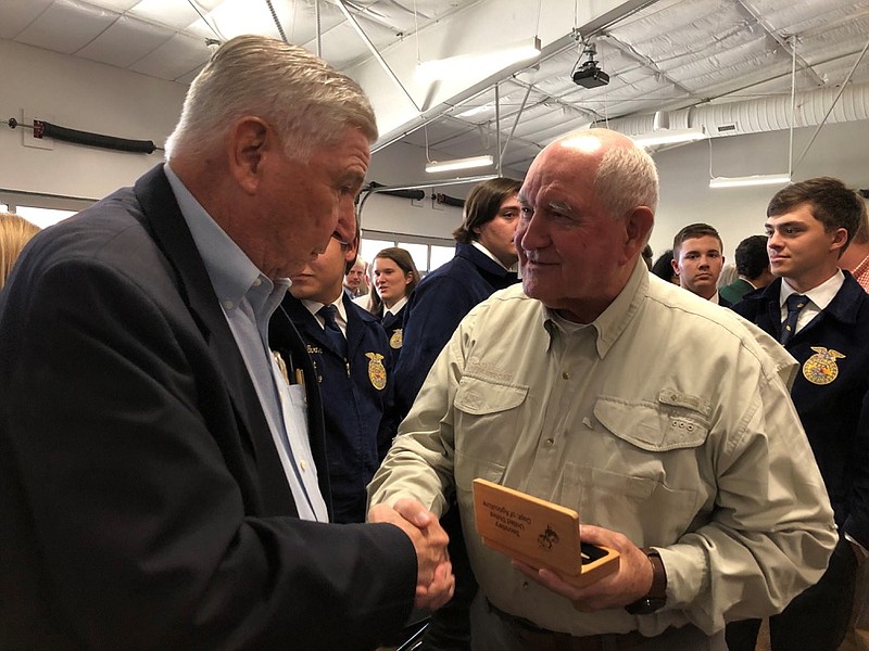 U.S. Secretary of Agriculture Sonny Perdue, right, shakes hands with a member of the agriculture industry who attended a town hall meeting on Friday, Oct. 18, 2019, in Memphis, Tenn. (AP Photo/Adrian Sainz)


