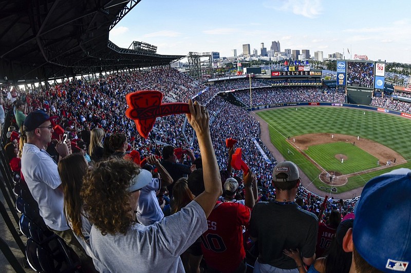 AP photo by John Amis / Atlanta Braves fans perform the chop with foam tomahawks during the ninth inning of a game against the Detroit Tigers on Oct. 2, 2016. It was the final game at Turner Field before the team moved to its present stadium, SunTrust Park.