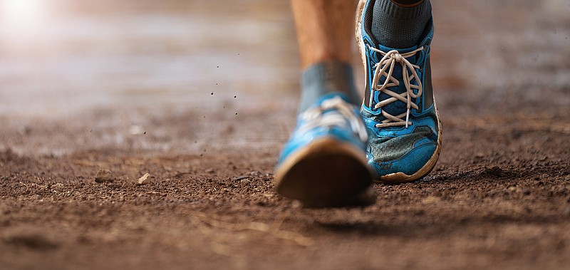 Trail running action close up of running shoes in action. / Pavel1964