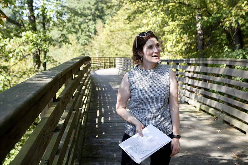 Staff photo by C.B. Schmelter / The Trust for Public Land Tennessee State Director Jenny Park talks about the construction of the final section of the South Chickamauga Creek Greenway to the Times Free Press while walking along the Greenway on Tuesday, Sept. 17, 2019 in Chattanooga, Tenn. Once completed the trail will connect Camp Jordan to the Tennessee Riverwalk.