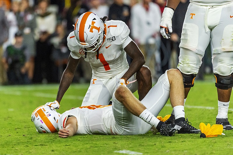 AP photo by Vasha Hunt / Tennessee wide receiver Marquez Callaway (1) checks on quarterback Brian Maurer after the freshman was injured during the first half of the Vols' 2019 game at Alabama.