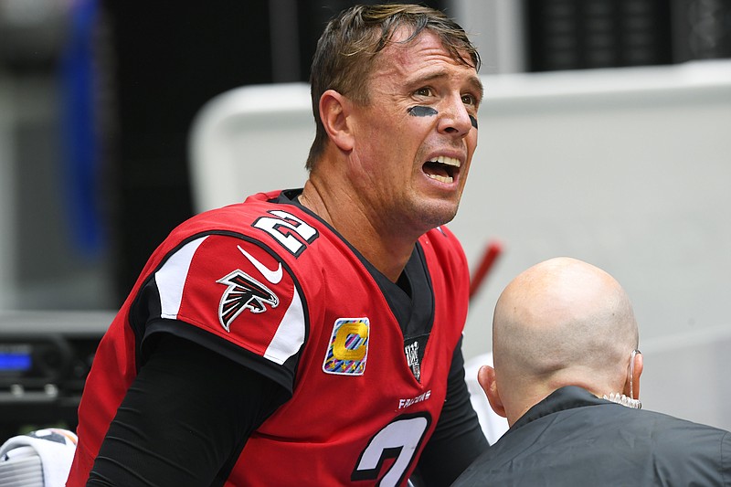 AP photo by John Amis / Atlanta Falcons quarterback Matt Ryan reacts as medical personnel attend to his injured ankle during Sunday's game against the Los Angeles Rams in Atlanta.