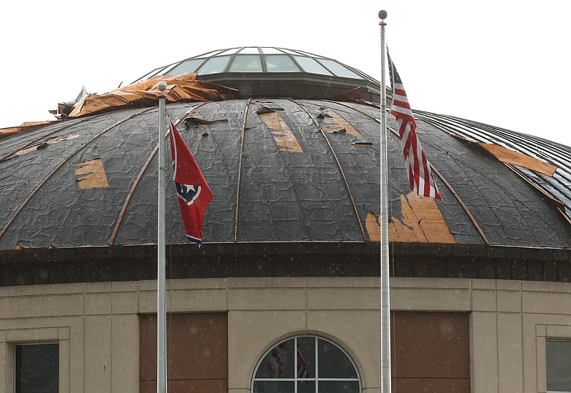 Staff file photo / Damage to the Chattanooga Airport roof is seen after severe wind and rain hit the area in July.
