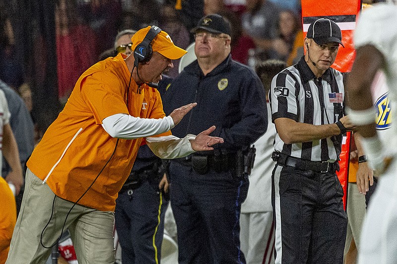 AP photo by Vasha Hunt / Tennessee football coach Jeremy Pruitt argues an official's call during Saturday night's game at Alabama.