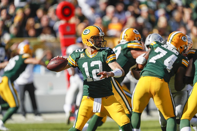 Green Bay Packers quarterback Aaron Rodgers looks to pass during an NFL football game between the Green Bay Packers and Oakland Raiders Sunday, Oct. 20, 2019, in Green Bay, Wis. (AP Photo/Matt Ludtke)