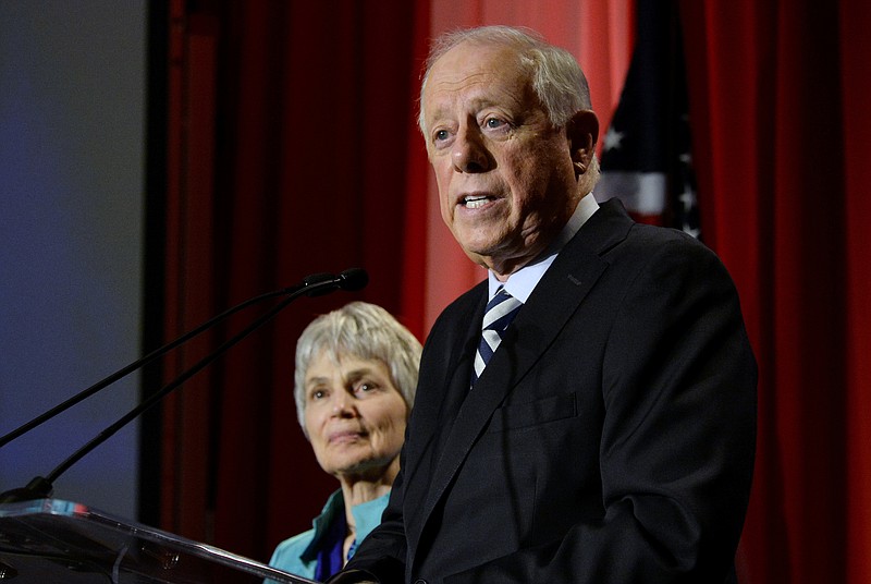 In this Nov. 6, 2018 file photo, Democratic Senate candidate, former Gov. Phil Bredesen speaks to supporters after he conceded to Rep. Marsha Blackburn, R-Tenn., in their race for the U.S. Senate in Nashville, Tenn., as his wife Andrea Conte stands next to him. A new business venture by Bredesen takes on global warming by helping companies fund solar panels in communities with dirty-power electric grids. The Democrat plans to introduce Clearloop on Tuesday, Oct. 22, 2019, at a conference headlined by former New York Mayor Michael Bloomberg. It's Bredesen's first big public foray since losing a U.S. Senate bid last year. (AP Photo/Mark Zaleski, File)