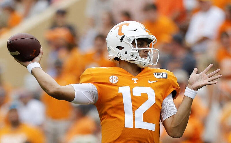 Staff photo by C.B. Schmelter / Tennessee quarterback J.T. Shrout (12) goes to pass against UTC during a NCAA football game at Neyland Stadium on Saturday, Sept. 14, 2019 in Knoxville, Tenn.