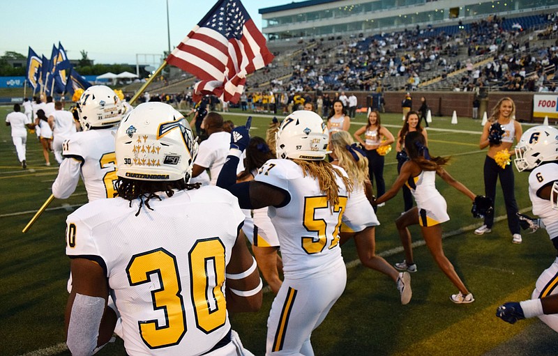 Staff Photo by Robin Rudd/  The Mocs take the field at Finley Stadium.  The University of Tennessee at Chattanooga Mocs hosted the East Tennessee State University Buccaneers in Southern Conference football at Chattanooga's Finley Stadium on October 17, 2019.