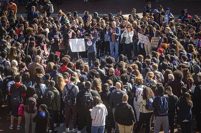 University of Connecticut students participate in a rally at UConn in front of the Student Union calling on administrative action in response to the video that surfaced last week of a group of students walking past a black student's dorm using racial slurs, in Storrs, Conn., Monday, Oct. 21, 2019.  (Mark Mirko/Hartford Courant via AP)


