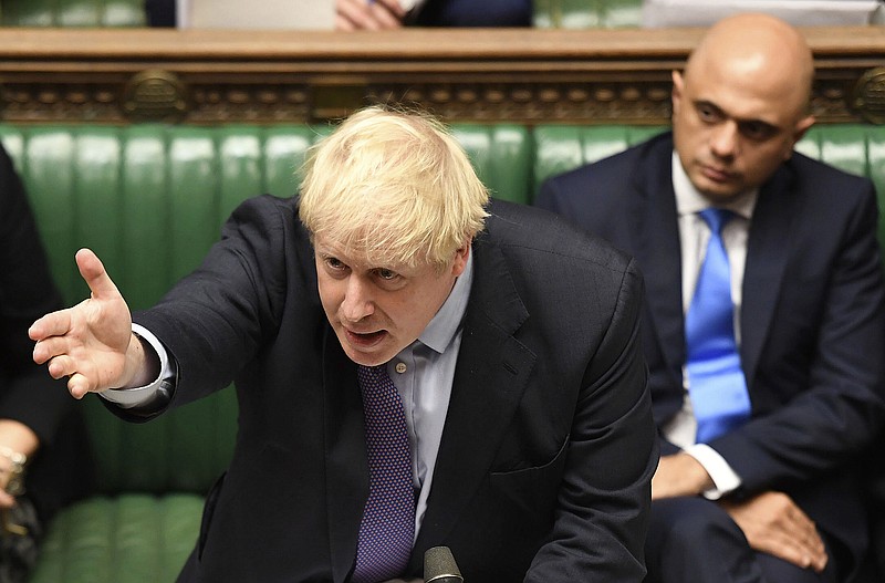Britain's Prime Minister Boris Johnson gestures as he speaks in the House of Commons in London during the debate for the EU Withdrawal Agreement Bill, Tuesday Oct. 22, 2019. British lawmakers have rejected the government’s fast-track attempt to pass its Brexit bill within days, demanding more time to scrutinize the complex legislation and throwing Prime Minister Boris Johnson’s exit timetable into chaos. (Jessica Taylor, UK Parliament via AP)