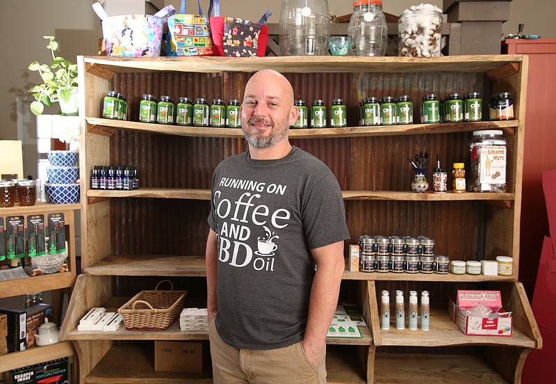 Steven Ellis poses for a photo at The Shop by Stevie and The Moon Wednesday, April 3, 2019 in Trenton, Georgia. The Lookout Mountain Judicial Circuit Drug Task Force, Dade County Sheriff's Office and Trenton Police Department raided Ellis' wellness shop on Thursday, seizing a bunch of CBD products with THC. Ellis said he was unsure of why some of the products were left behind while others were seized.