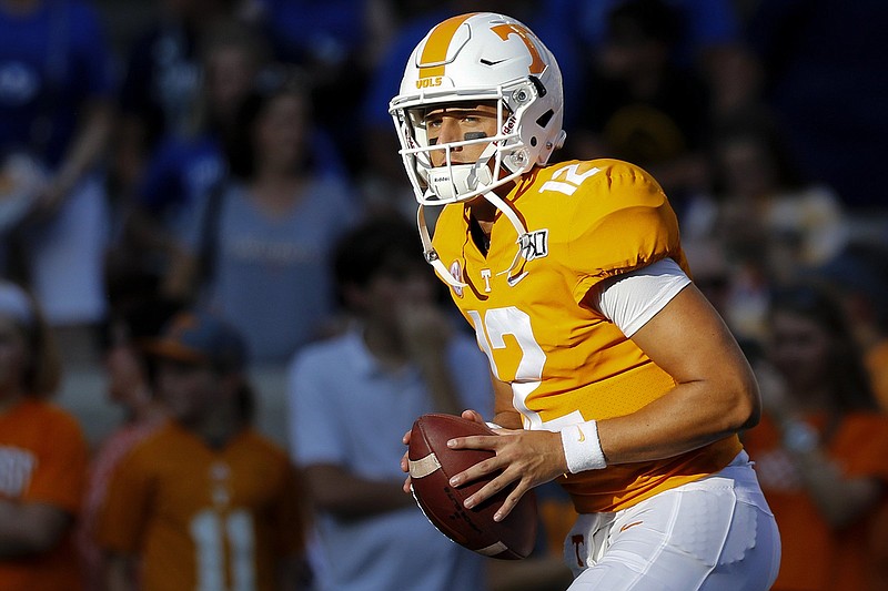 Staff photo by C.B. Schmelter / Tennessee quarterback J.T. Shrout warms up for a home game against BYU on Sept. 7.