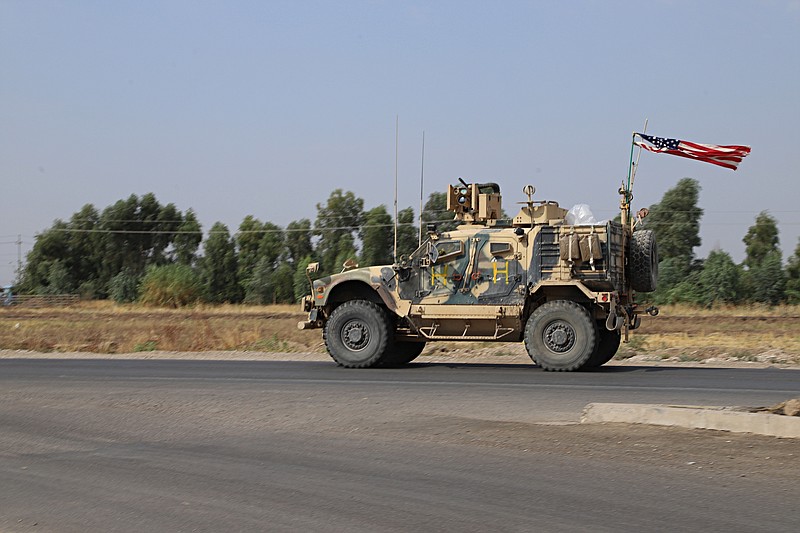 A U.S. military vehicle, part of a convoy, arrives near Dahuk, Iraqi, Monday, Oct. 21, 2019. Defense Secretary Mark Esper said Monday that under the current plan all U.S. troops leaving Syria will go to western Iraq and the military will continue to conduct operations against the Islamic State group to prevent its resurgence. (AP Photo)