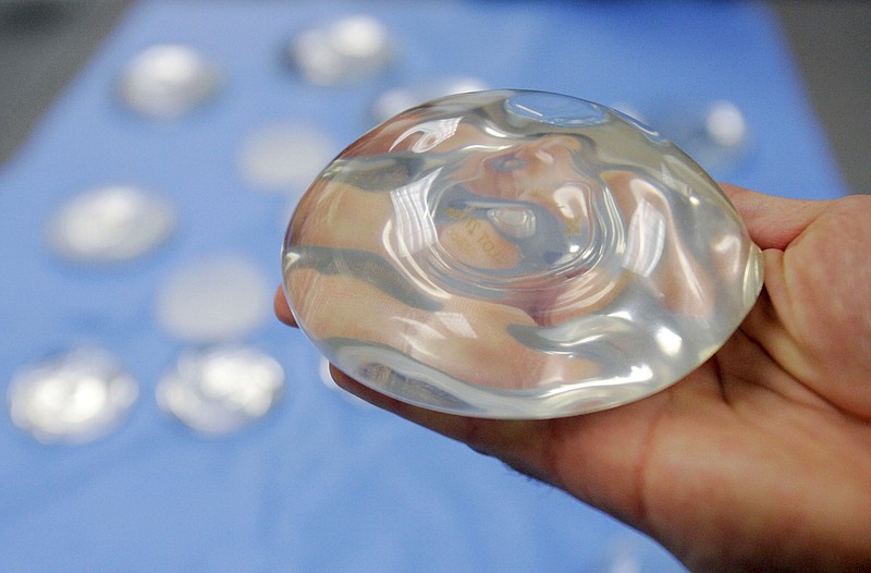 This Dec. 11, 2006, file photo shows a silicone gel breast implant in Irving, Texas. On Wednesday, Oct. 23, 2019, the U.S. Food and Drug Administration said that breast implant manufacturers should add a boxed warning — the most serious type — to information used to market and prepare patients for implants. (AP Photo/Donna McWilliam, File)