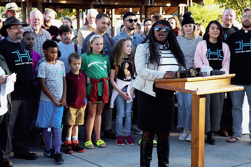 Staff photo by Wyatt Massey / The Rev. Charlotte Williams, CALEB board chair and pastor of Eastdale Village Community United Methodist Church, speaks at the press conference announcing the creation of the immigration bond fund at Highland Park Commons on Oct. 24.