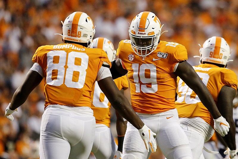 Staff photo by C.B. Schmelter / Tennessee defensive lineman LaTrell Bumphus (88) is congratulated by linebacker Darrell Taylor after sacking BYU quarterback Zach Wilson on Sept. 7 at Neyland Stadium.