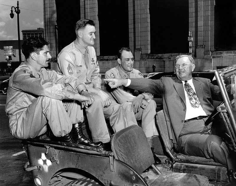 Photo Courtesy of Vince Butler / This the famous photo of the four Medal of Honor recipients in the Armed Forces Day parade in Chattanooga. WWI recipient Alvin York is driving the jeep, and the WWII recipient in the back are, left to right, Paul Huff, Charles Coolidge and Raymond Cooley.