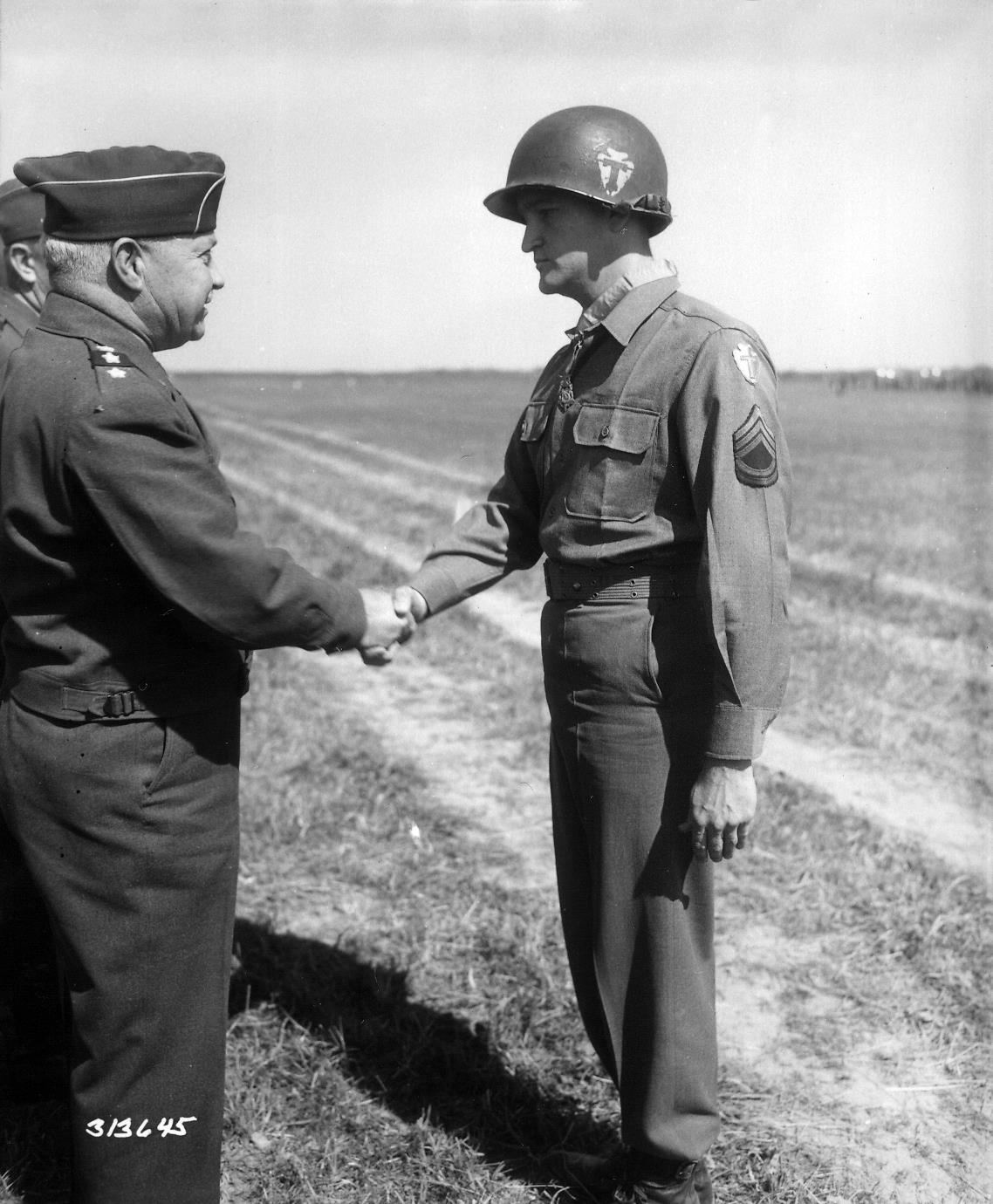 Charles H. Coolidge is presented with the Medal of Honor on the battlefield by Army Lt. Gen. Wade H. Haislip on June 18, 1945, near Dornstadt, Germany. / Contributed photo