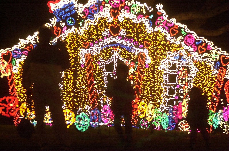 Visitors to Rock City's Enchanted Garden of Lights atop Lookout Mountain enjoy the colorful display of Christmas lights at Candyland.