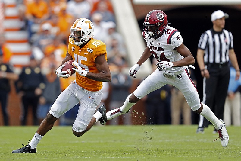 AP Photo by Wade Payne / Tennessee wide receiver Jauan Jennings outruns South Carolina defensive back Israel Mukuamu during Saturday's game at Neyland Stadium in Knoxville.