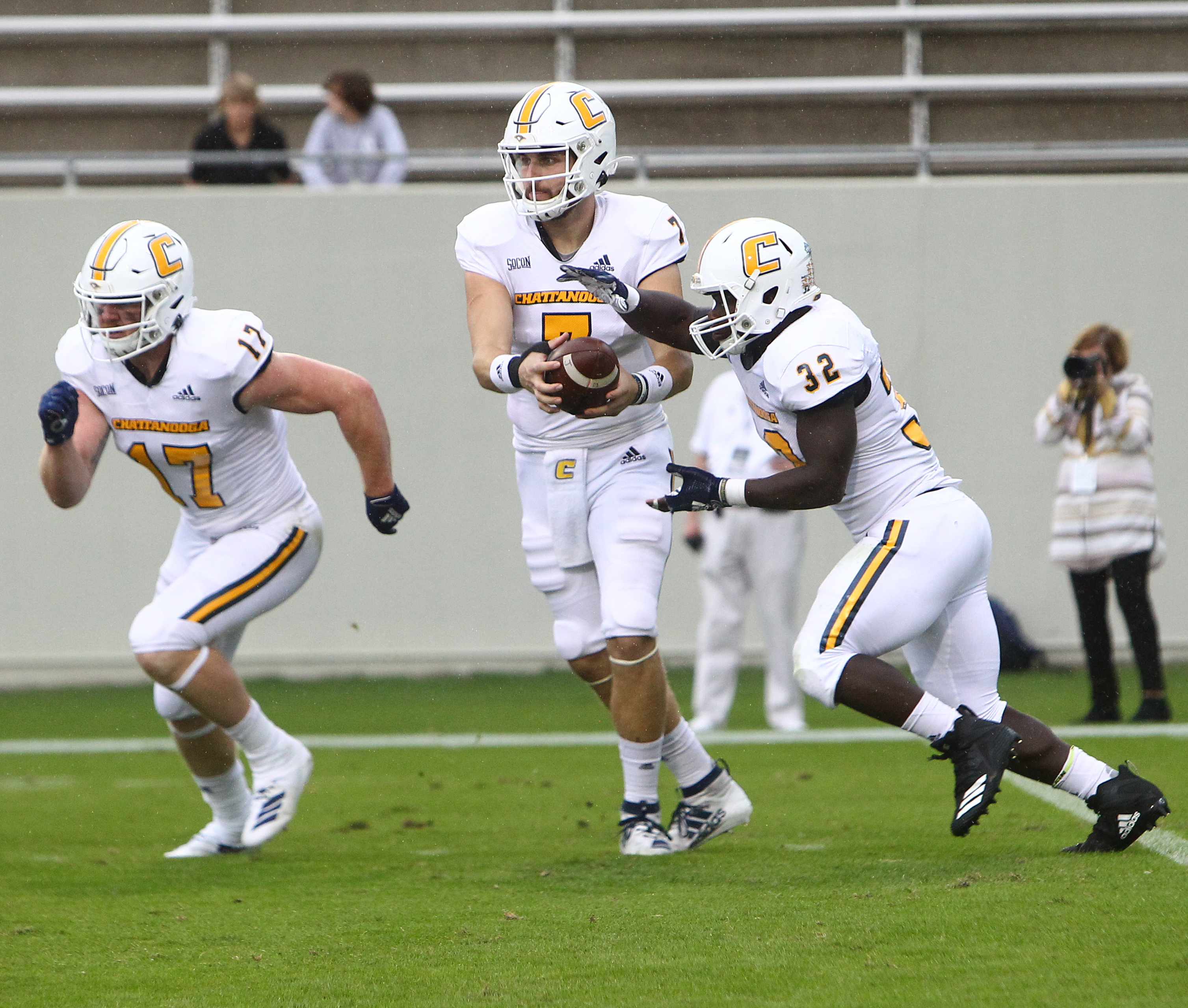 UTC Athletics photo by Dale Rutemeyer / UTC quarterback Nick Tiano hands off to Ailym Ford during Saturday's game at Wofford.