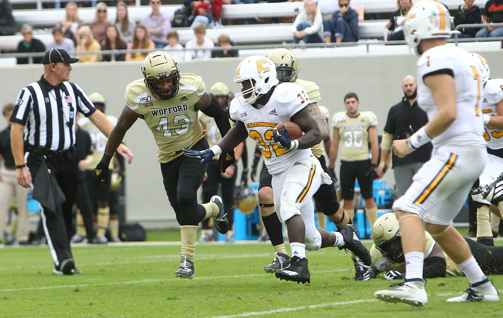 UTC Athletics photo by Dale Rutemeyer / UTC running back Ailym Ford tries to angle past Wofford linebacker Shaun Moore during Saturday's game in Spartanburg, S.C.