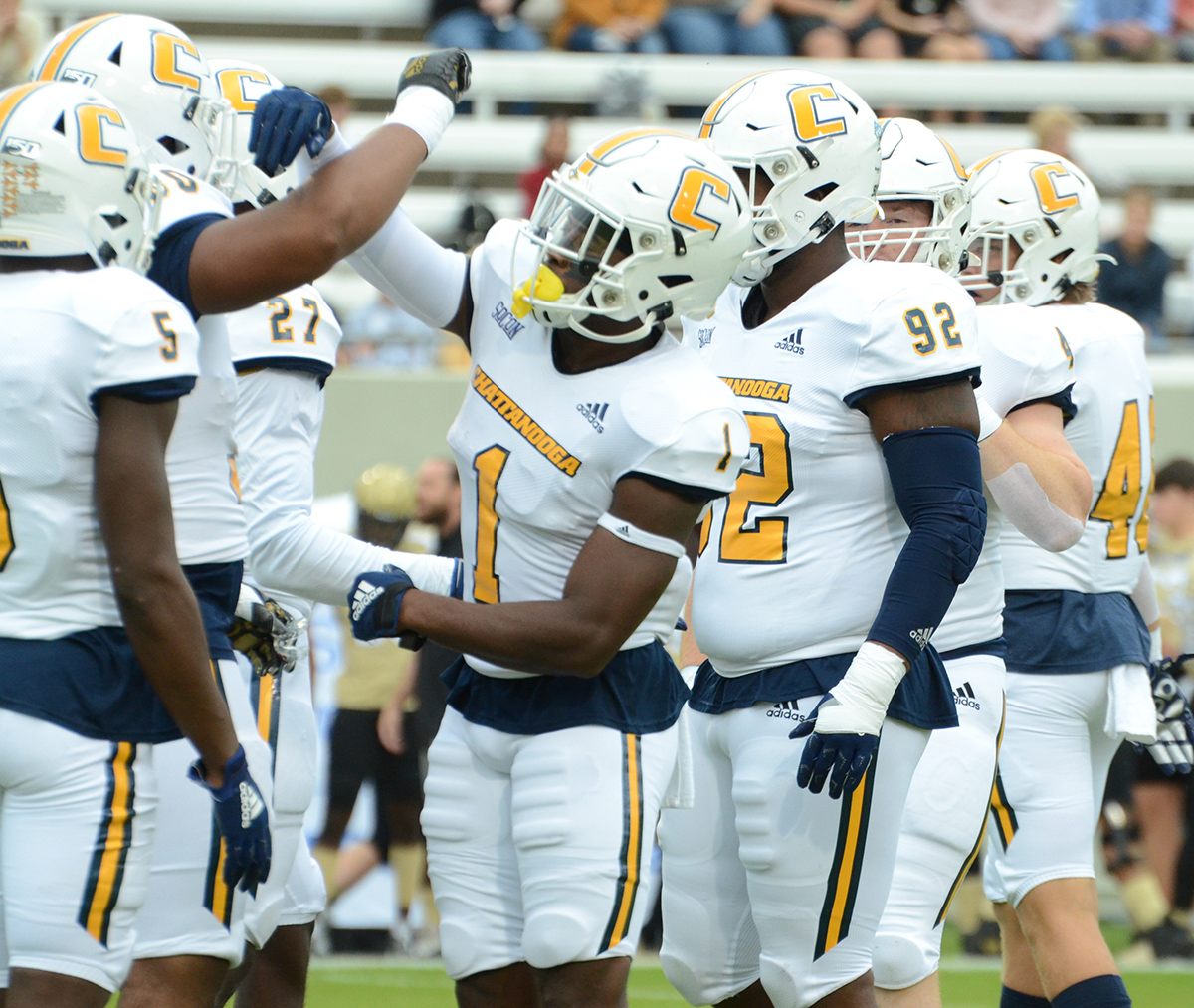 UTC Athletics photo by Laura O'Dell / UTC defensive back Brandon Dowdell (1) and his teammates greet one another during Saturday's game in Spartanburg, S.C.
