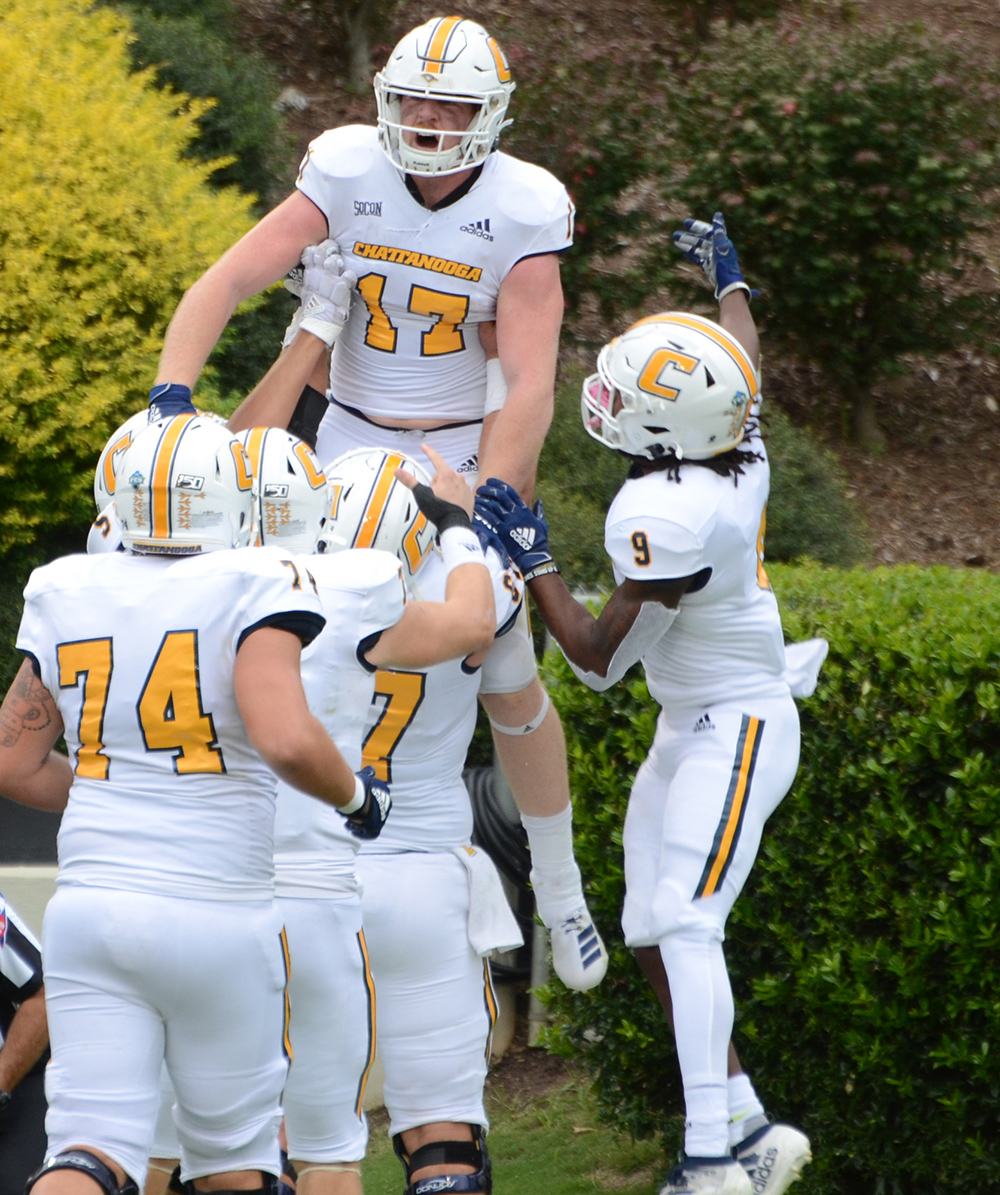 UTC Athletics photo by Laura O'Dell / UTC tight end Chris James celebrates with teammates during Saturday's game in Spartanburg, S.C.