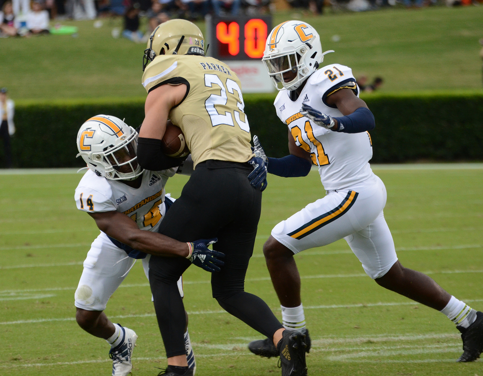 UTC Athletics photo by Laura O'Dell / UTC's Jordan Jones tackles Wofford wide receiver Landon Parker as fellow Mocs defensive back D.J. Jackson closes in during Saturday's game in Spartanburg, S.C.