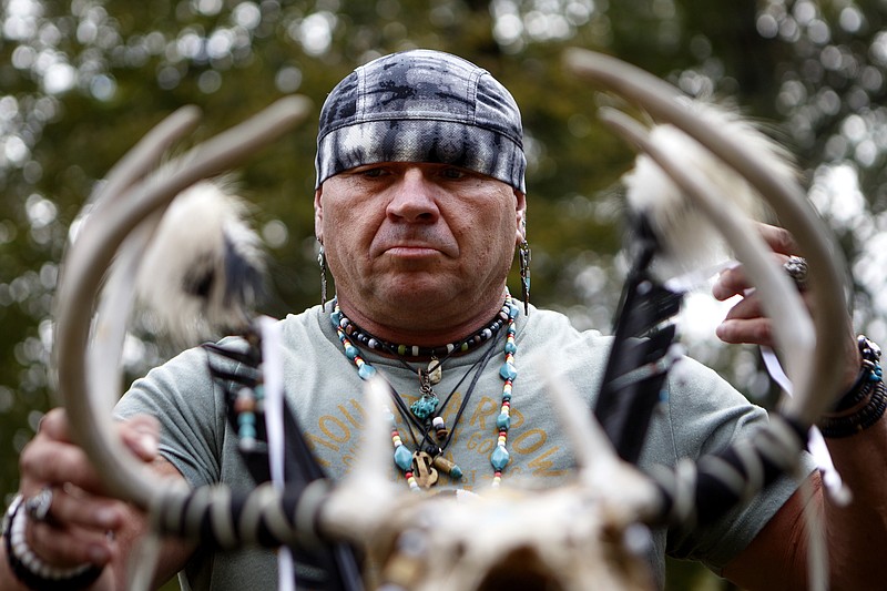 Staff photo by C.B. Schmelter / Wes Collins sets up his regalia before getting dressed during the Red Clay Pow Wow at Red Clay State Historic Park on Sunday, Oct. 27, 2019 in Cleveland, Tenn. The Pow Wow, which included traditional Native American dance and music, was sponsored Friends of Red Clay and the Native American Services of Tennessee.