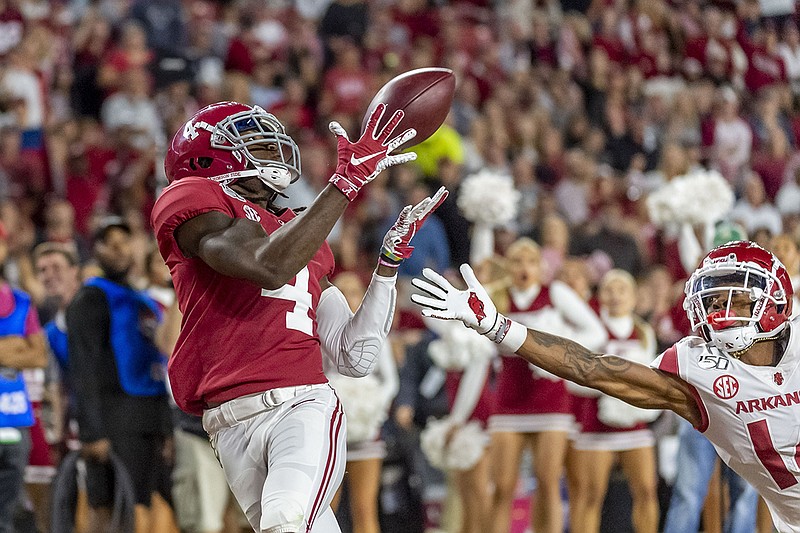 AP photo by Vasha Hunt / Alabama wide receiver Jerry Jeudy makes a touchdown catch against Arkansas during the second half of Saturday night's game in Tuscaloosa, Ala.