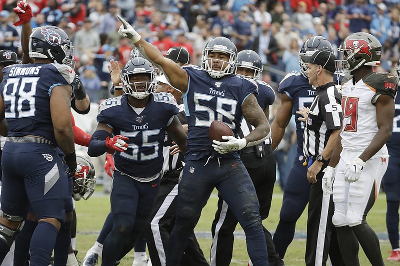 AP photo by James Kenney / Tennessee Titans linebacker Harold Landry (58) celebrates after recovering a fumble during the fourth quarter of Sunday's game against the Tampa Bay Buccaneers in Nashville.