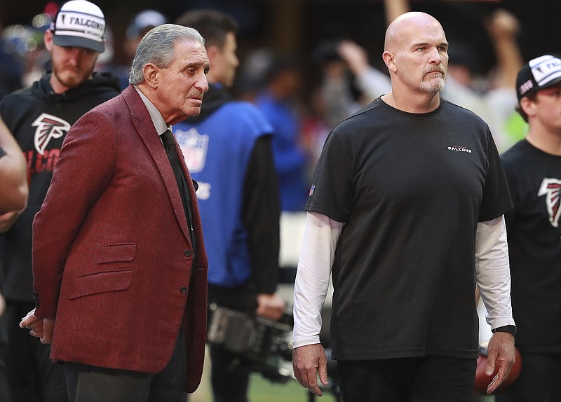 AP photo by Curtis Compton / Atlanta Falcons owner Arthur Blank, left, and coach Dan Quinn watch the team warm up for Sunday's game against the Seattle Seahawks at Mercedes-Benz Stadium in Atlanta.