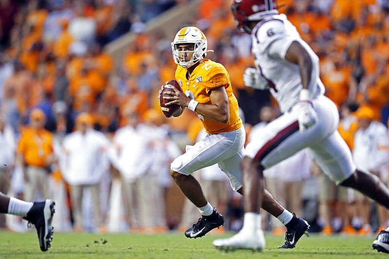 AP photo by Wade Payne / Tennessee quarterback Jarrett Guarantano rolls out to pass during the second half of Saturday's home game against South Carolina. He threw two touchdown passes and the Vols won 41-21.