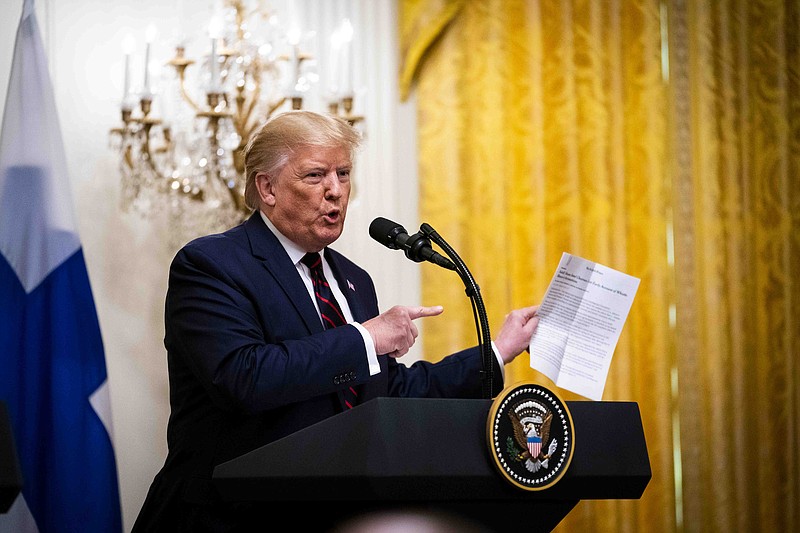 FILE -- President Donald Trump holds a printout of a New York Times article while appearing before reporters in Washington, Oct. 2, 2019. "President Snowflake had a pout this past week and canceled the White House subscriptions to The Times and The Washington Post," writes Maureen Dowd. (Doug Mills/The New York Times)