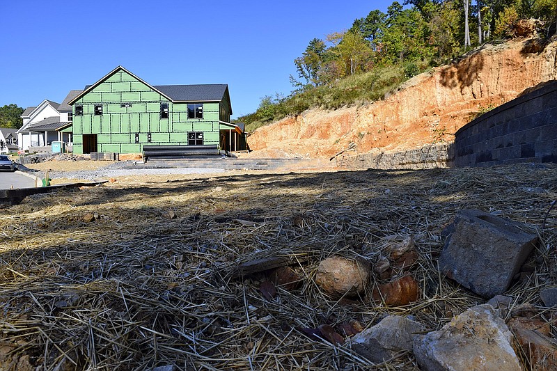 Staff file photo by Robin Rudd/ A new home nears completion of Carrington Way off of Dartmouth Street in North Chattanooga. In the foregroun, a lot has been cut from the hillside.