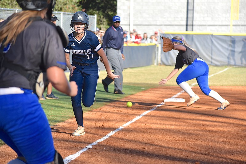 Staff photo by Patrick MacCoon / Gordon Lee's Emma Phillips races home to score the winning run in Monday's state championship game against Trion.