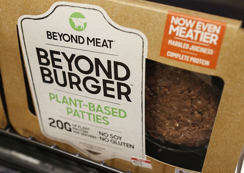 FILE - In this June 27, 2019, file photo a meatless burger patty called Beyond Burger made by Beyond Meat is displayed at a grocery store in Richmond, Va. (AP Photo/Steve Helber, File)


