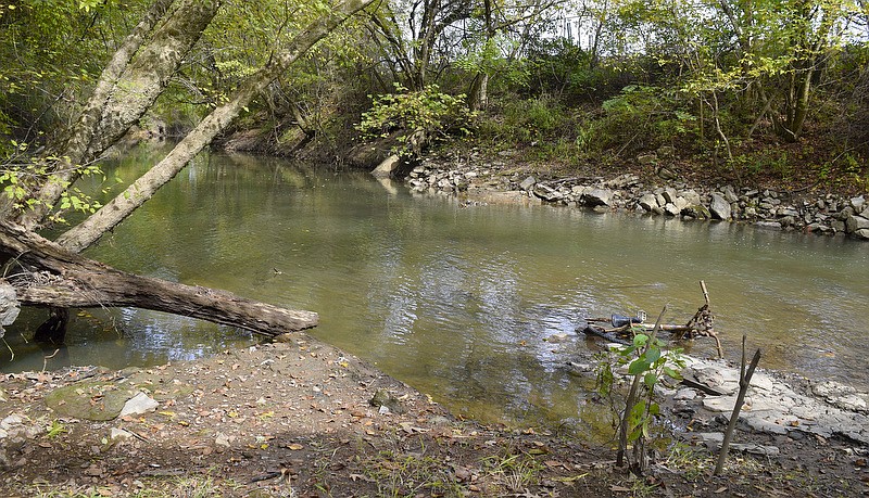 Staff Photo by Robin Rudd/  on October 29, 2019. A discarded bicycle sits in the waters of Chattanooga Creek near Workman Road. The area around Chattanooga Creek and Workman Road has been delisted from the National Priorities List, meaning it has been cleaned to EPA standards. Chattanooga Creek was photographed on October 29, 2019.