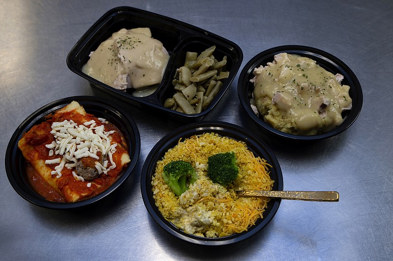 Turkey and dressing, casseroles and lasagna, clockwise from top left, are among the many choices that come in individual or family sizes. / Photo by David Humber