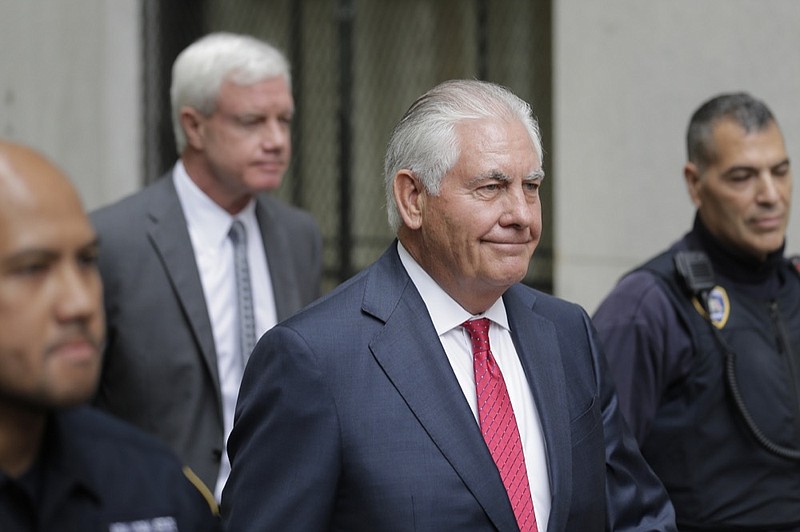 Former Exxon CEO and ex-Secretary of State Rex Tillerson, second from right, leaves a courthouse in New York, Wednesday, Oct. 30, 2019. (AP Photo/Seth Wenig)


