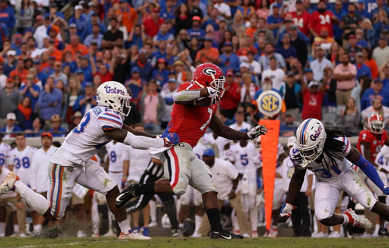 Georgia photo by Lauren Tolbert / Georgia tailback D'Andre Swift runs for some of his 104 yards during last season's 36-17 win over Florida in Jacksonville. The Georgia-Florida showdown is the SEC's only annual regular-season matchup held at a neutral site.
