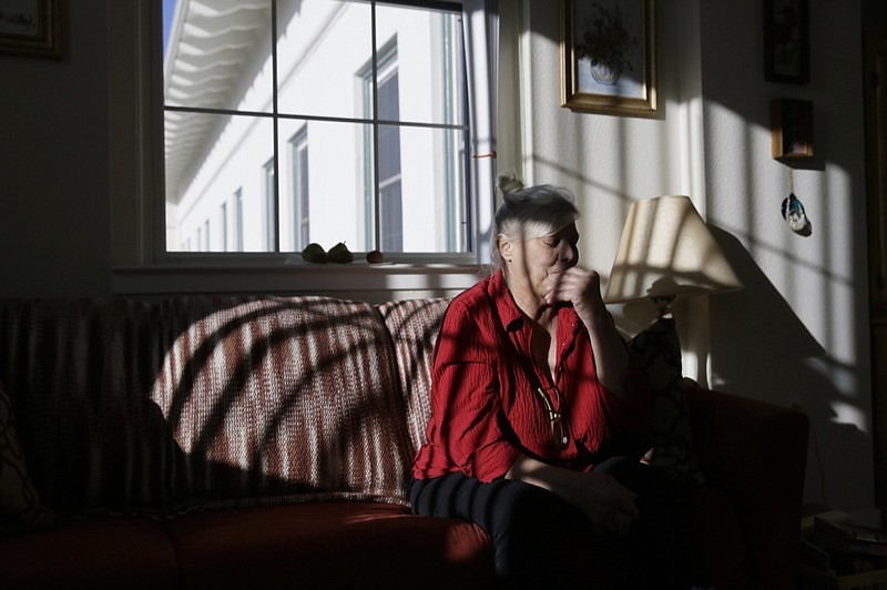 Pamela Zuzak, 70, reflects on her experiences of being stranded in the dark during the power blackouts at the Villas at Hamilton housing complex for low income seniors Wednesday, Oct. 30, 2019, in Novato, Calif. Pacific Gas & Electric officials said they understood the hardships caused by the blackouts but insisted they were necessary. (AP Photo/Eric Risberg)


