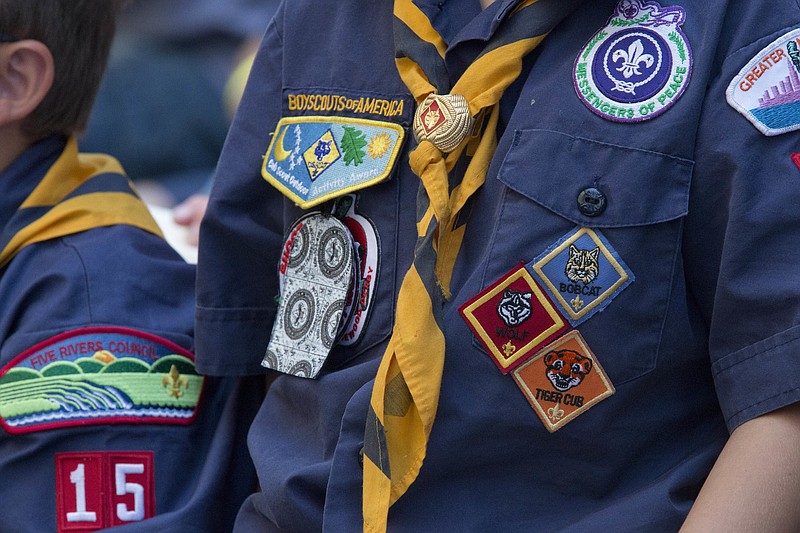 FILE- In this June 25, 2016, file photo, Cub Scouts watch a race during the Second Annual World Championship Pinewood Derby in New York's Times Square. In January 2020, the Boy Scouts of America will increase its annual youth membership fee by more than 80% as it faces a potentially ruinous wave of new sex-abuse lawsuits. (AP Photo/Mary Altaffer, File)

