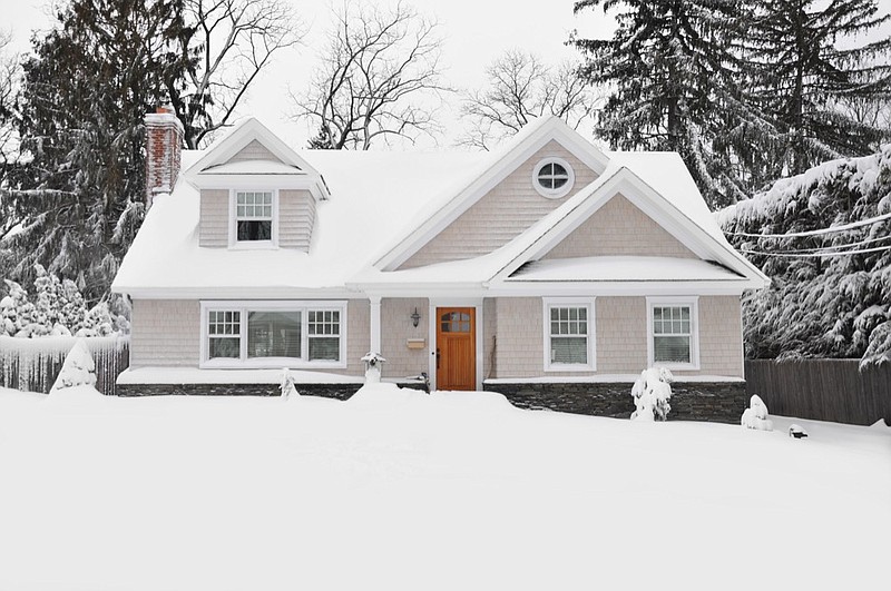 Winter Snow Craftman Cape Cod Style Home winter tile house tile snow / Getty Images
